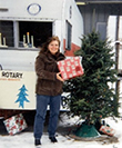 Ann (Dec. 2005) selling trees to raise funds for the Rotary Club
